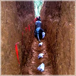 Sampling saprolite every meter in trench / Mandingo Hill