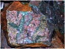 (Click to enlarge)   Malachite and Chalcopyrite stained boulder / Queen Victoria    